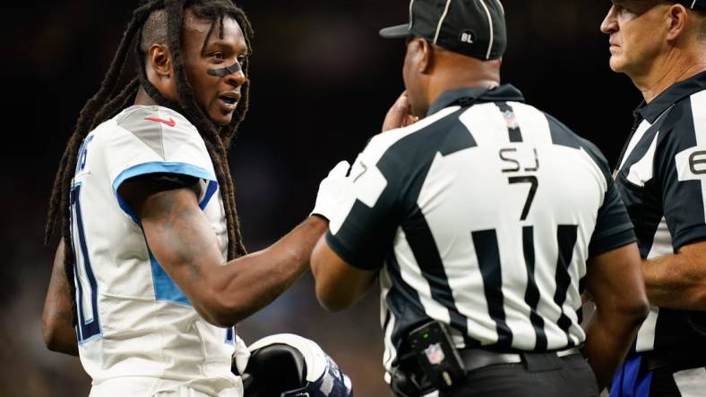 Sep 10, 2023; New Orleans, LA, USA; Tennessee Titans wide receiver DeAndre Hopkins (10) disputes a call with side judge Keith Washington (7) in the second quarter against the New Orleans Saints at Caesars Superdome. Mandatory Credit: Andrew Nelles-USA TODAY Sports