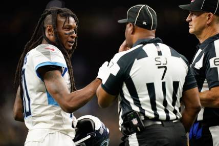 Sep 10, 2023; New Orleans, LA, USA; Tennessee Titans wide receiver DeAndre Hopkins (10) disputes a call with side judge Keith Washington (7) in the second quarter against the New Orleans Saints at Caesars Superdome. Mandatory Credit: Andrew Nelles-USA TODAY Sports