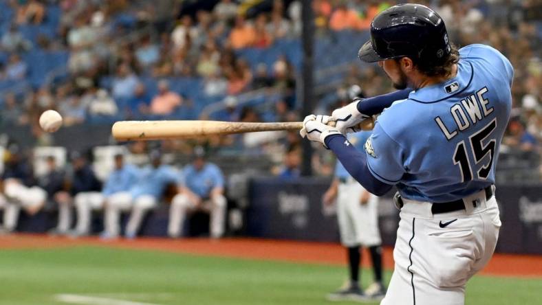 Sep 10, 2023; St. Petersburg, Florida, USA; Tampa Bay Rays right fielder Josh Lowe (15) hits a RBI double in the first inning against the Seattle Mariners  at Tropicana Field. Mandatory Credit: Jonathan Dyer-USA TODAY Sports