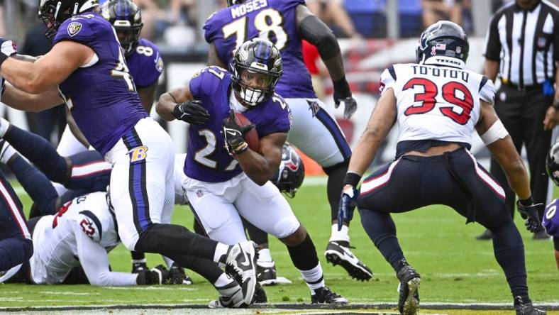 Sep 10, 2023; Baltimore, Maryland, USA; Baltimore Ravens running back J.K. Dobbins (27) carries the ball against the Houston Texans during the first half at M&T Bank Stadium. Mandatory Credit: Brad Mills-USA TODAY Sports