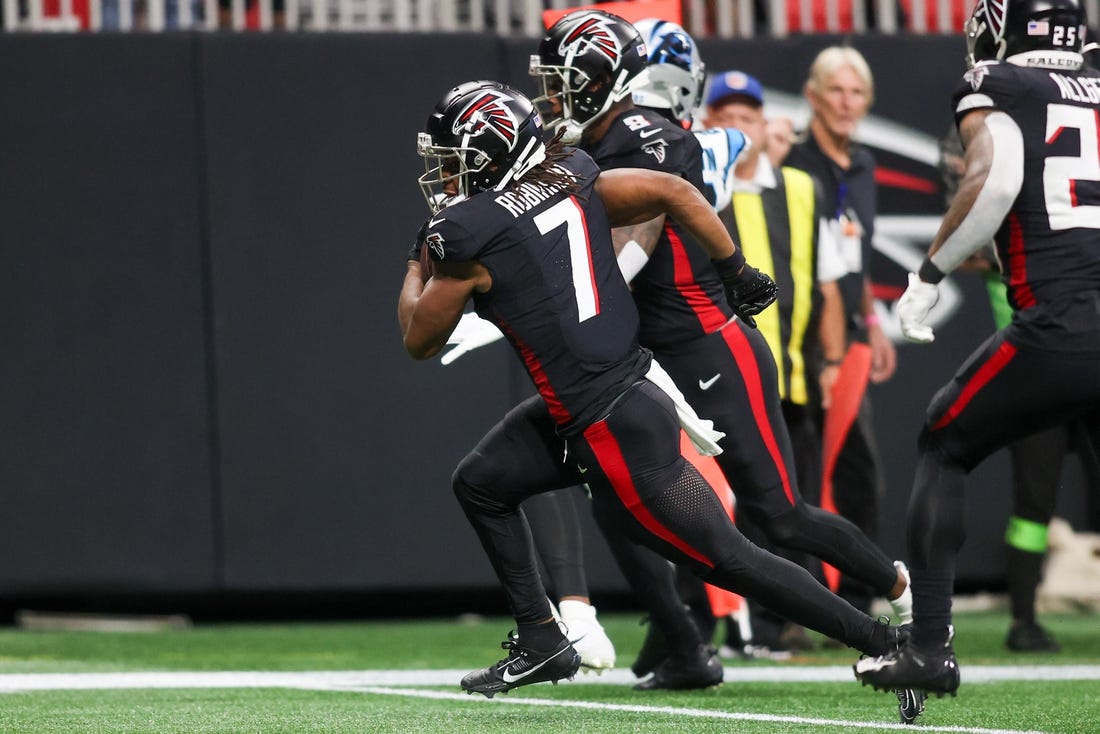 Sep 10, 2023; Atlanta, Georgia, USA; Atlanta Falcons running back Bijan Robinson (7) runs after a catch for a touchdown against the Carolina Panthers in the second quarter at Mercedes-Benz Stadium. Mandatory Credit: Brett Davis-USA TODAY Sports