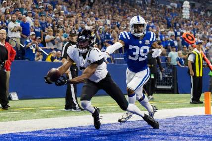 Sep 10, 2023; Indianapolis, Indiana, USA; Jacksonville Jaguars wide receiver Zay Jones (7) dives for a touchdown catch while Indianapolis Colts cornerback Darrell Baker Jr. (39) defends in the second quarter at Lucas Oil Stadium. Mandatory Credit: Trevor Ruszkowski-USA TODAY Sports