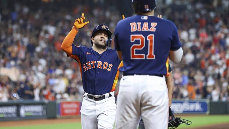 Sep 10, 2023; Houston, Texas, USA; Houston Astros second baseman Jose Altuve (27) celebrates after hitting a home run during the third inning against the San Diego Padres at Minute Maid Park. Mandatory Credit: Troy Taormina-USA TODAY Sports