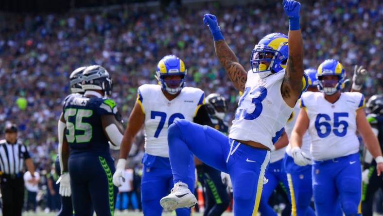 Sep 10, 2023; Seattle, Washington, USA; Los Angeles Rams running back Kyren Williams (23) celebrates scoring a touchdown against the Seattle Seahawks during the first half at Lumen Field. Mandatory Credit: Steven Bisig-USA TODAY Sports