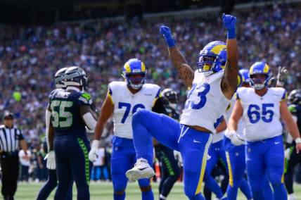 Sep 10, 2023; Seattle, Washington, USA; Los Angeles Rams running back Kyren Williams (23) celebrates scoring a touchdown against the Seattle Seahawks during the first half at Lumen Field. Mandatory Credit: Steven Bisig-USA TODAY Sports