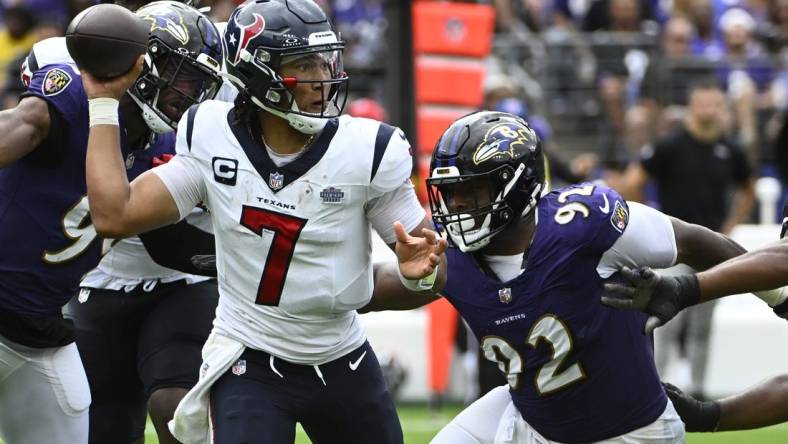 Sep 10, 2023; Baltimore, Maryland, USA; Houston Texans quarterback C.J. Stroud (7) attempts a pass as Baltimore Ravens defensive tackle Rayshad Nichols (91) rushes during the second half at M&T Bank Stadium. Mandatory Credit: Brad Mills-USA TODAY Sports