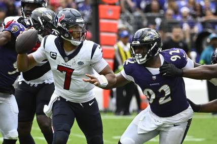 Sep 10, 2023; Baltimore, Maryland, USA; Houston Texans quarterback C.J. Stroud (7) attempts a pass as Baltimore Ravens defensive tackle Rayshad Nichols (91) rushes during the second half at M&T Bank Stadium. Mandatory Credit: Brad Mills-USA TODAY Sports