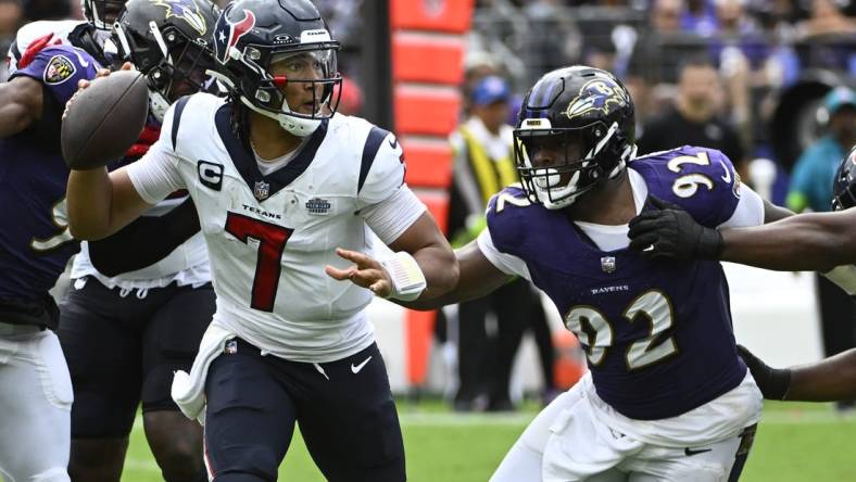 Sep 10, 2023; Baltimore, Maryland, USA; Houston Texans quarterback C.J. Stroud (7) attempts a pass as Baltimore Ravens defensive tackle Rayshad Nichols (91) rushes during the second half at M&T Bank Stadium. Mandatory Credit: Brad Mills-USA TODAY Sports