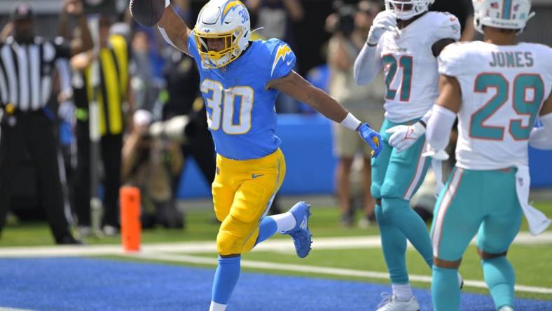 Sep 10, 2023; Inglewood, California, USA; Los Angeles Chargers running back Austin Ekeler (30) celebrates after a touchdown in the first half against the Miami Dolphins at SoFi Stadium. Mandatory Credit: Jayne Kamin-Oncea-USA TODAY Sports