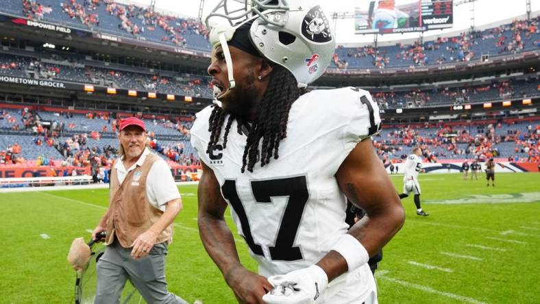 Sep 10, 2023; Denver, Colorado, USA; Las Vegas Raiders wide receiver Davante Adams (17) reacts following the win over the Denver Broncos at Empower Field at Mile High. Mandatory Credit: Ron Chenoy-USA TODAY Sports