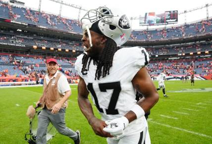 Sep 10, 2023; Denver, Colorado, USA; Las Vegas Raiders wide receiver Davante Adams (17) reacts following the win over the Denver Broncos at Empower Field at Mile High. Mandatory Credit: Ron Chenoy-USA TODAY Sports