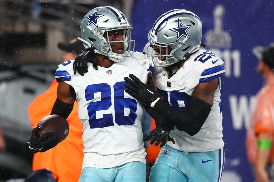 Sep 10, 2023; East Rutherford, New Jersey, USA; Dallas Cowboys cornerback DaRon Bland (26) celebrates his touchdown against the New York Giants during the first half at MetLife Stadium. Mandatory Credit: Ed Mulholland-USA TODAY Sports