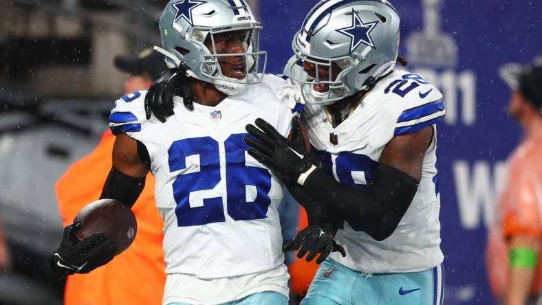 Sep 10, 2023; East Rutherford, New Jersey, USA; Dallas Cowboys cornerback DaRon Bland (26) celebrates his touchdown against the New York Giants during the first half at MetLife Stadium. Mandatory Credit: Ed Mulholland-USA TODAY Sports