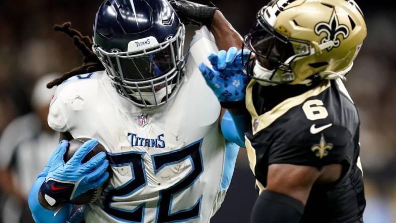 Tennessee Titans running back Derrick Henry (22) pushes away New Orleans Saints safety Marcus Maye (6) during the first quarter at the Caesars Superdome in New Orleans, La., Sunday, Sept. 10, 2023.