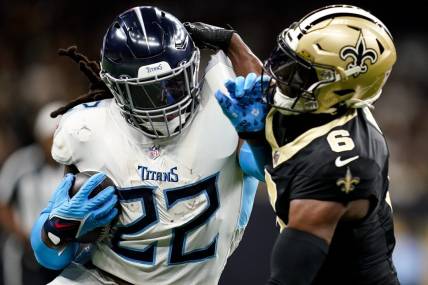 Tennessee Titans running back Derrick Henry (22) pushes away New Orleans Saints safety Marcus Maye (6) during the first quarter at the Caesars Superdome in New Orleans, La., Sunday, Sept. 10, 2023.
