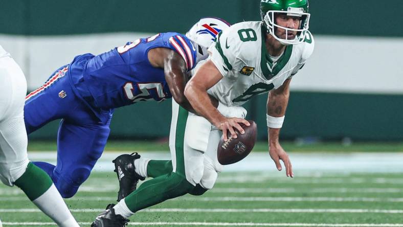 Sep 11, 2023; East Rutherford, New Jersey, USA; New York Jets quarterback Aaron Rodgers (8) is injured while being sacked by Buffalo Bills defensive end Leonard Floyd (56) during the first half at MetLife Stadium. Mandatory Credit: Vincent Carchietta-USA TODAY Sports