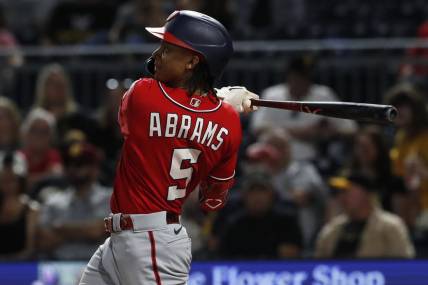 Sep 11, 2023; Pittsburgh, Pennsylvania, USA;  Washington Nationals shortstop CJ Abrams (5) hits a solo home run  against the Pittsburgh Pirates during the seventh inning at PNC Park. Mandatory Credit: Charles LeClaire-USA TODAY Sports