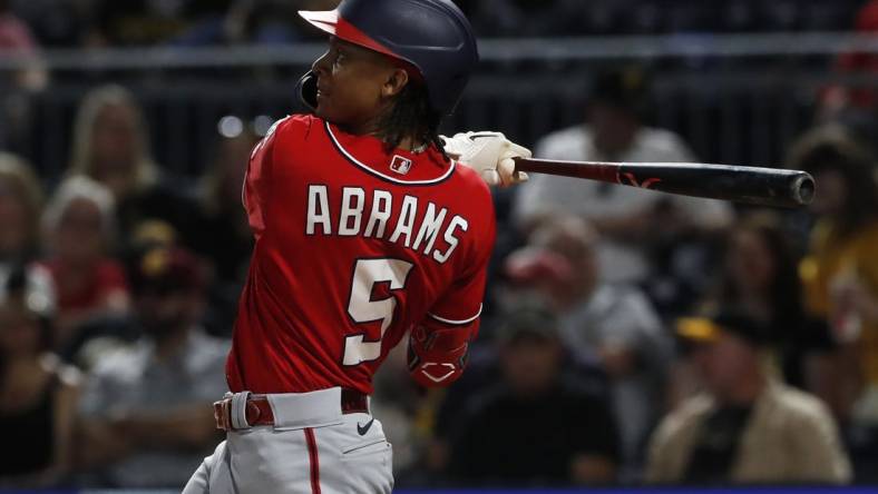 Sep 11, 2023; Pittsburgh, Pennsylvania, USA;  Washington Nationals shortstop CJ Abrams (5) hits a solo home run  against the Pittsburgh Pirates during the seventh inning at PNC Park. Mandatory Credit: Charles LeClaire-USA TODAY Sports