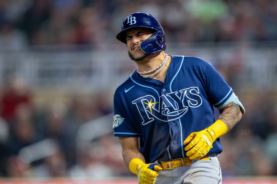 Sep 11, 2023; Minneapolis, Minnesota, USA; Tampa Bay Rays center fielder Jose Siri (22) reacts after getting hit in the hand by a pitch against the Minnesota Twins in the fifth inning at Target Field. Mandatory Credit: Jesse Johnson-USA TODAY Sports