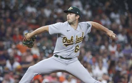 Sep 11, 2023; Houston, Texas, USA; Oakland Athletics relief pitcher Ken Waldichuk (64) delivers a pitch during the sixth inning against the Houston Astros at Minute Maid Park. Mandatory Credit: Troy Taormina-USA TODAY Sports