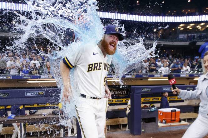 Sep 11, 2023; Milwaukee, Wisconsin, USA;  Milwaukee Brewers pitcher Brandon Woodruff (53) gets dunked with Gatorade following the game against the Miami Marlins at American Family Field. Mandatory Credit: Jeff Hanisch-USA TODAY Sports