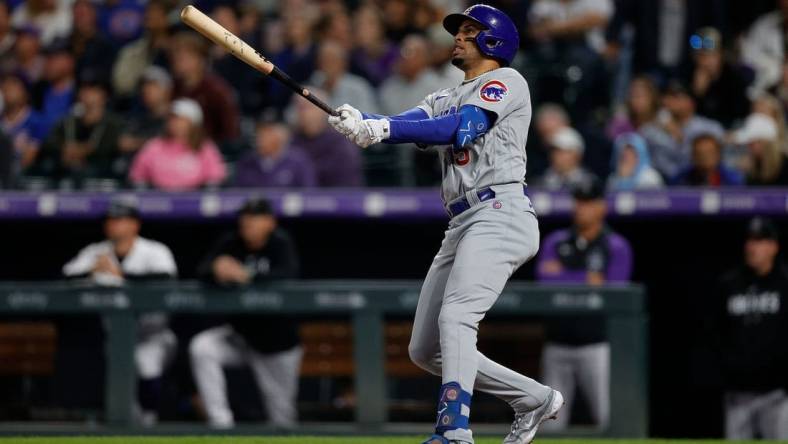 Sep 11, 2023; Denver, Colorado, USA; Chicago Cubs designated hitter Christopher Morel (5) watches his ball on a solo home run in the fifth inning against the Colorado Rockies at Coors Field. Mandatory Credit: Isaiah J. Downing-USA TODAY Sports