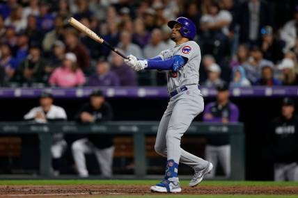 Sep 11, 2023; Denver, Colorado, USA; Chicago Cubs designated hitter Christopher Morel (5) watches his ball on a solo home run in the fifth inning against the Colorado Rockies at Coors Field. Mandatory Credit: Isaiah J. Downing-USA TODAY Sports