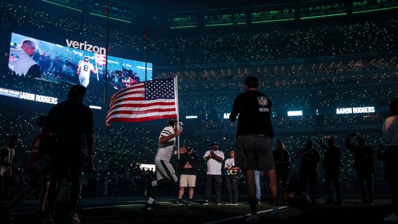 Sep 11, 2023; East Rutherford, New Jersey, USA; New York Jets quarterback Aaron Rodgers (8) runs on to the field at MetLife Stadium before the game against the Buffalo Bills. Mandatory Credit: Vincent Carchietta-USA TODAY Sports