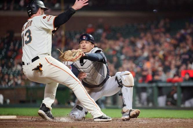 Sep 11, 2023; San Francisco, California, USA; Cleveland Guardians catcher Bo Naylor (23) tags out San Francisco Giants outfielder Austin Slater (13) on a force play at home plate during the seventh inning at Oracle Park. Mandatory Credit: Robert Edwards-USA TODAY Sports