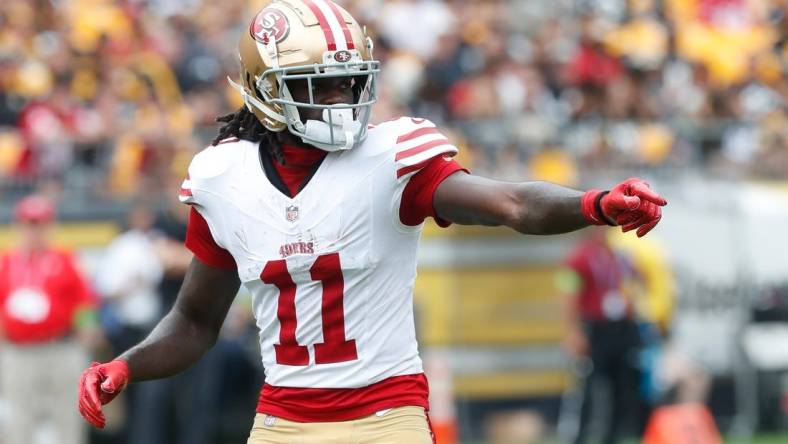 Sep 10, 2023; Pittsburgh, Pennsylvania, USA;  San Francisco 49ers wide receiver Brandon Aiyuk (11) gestures at the line of scrimmage against the Pittsburgh Steelers during the first quarter at Acrisure Stadium. Mandatory Credit: Charles LeClaire-USA TODAY Sports