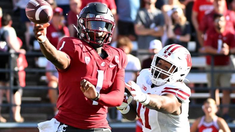 Sep 9, 2023; Pullman, Washington, USA; Washington State Cougars quarterback Cameron Ward (1) against Wisconsin Badgers defensive lineman Will McDonald (77) in the first half at Gesa Field at Martin Stadium. Mandatory Credit: James Snook-USA TODAY Sports