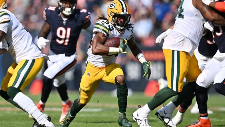 Sep 10, 2023; Chicago, Illinois, USA;  Green Bay Packers running back Aaron Jones (33) runs with the ball against the Chicago Bears at Soldier Field. Mandatory Credit: Jamie Sabau-USA TODAY Sports