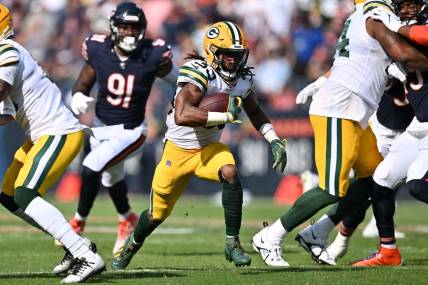 Sep 10, 2023; Chicago, Illinois, USA;  Green Bay Packers running back Aaron Jones (33) runs with the ball against the Chicago Bears at Soldier Field. Mandatory Credit: Jamie Sabau-USA TODAY Sports