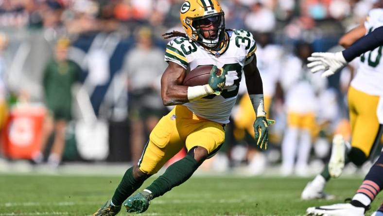 Sep 10, 2023; Chicago, Illinois, USA;  Green Bay Packers running back Aaron Jones (33) runs with the ball against the Chicago Bears at Soldier Field. Mandatory Credit: Jamie Sabau-USA TODAY Sports