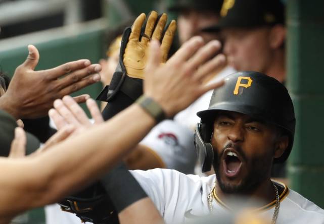 Sep 12, 2023; Pittsburgh, Pennsylvania, USA; Pittsburgh Pirates right fielder Joshua Palacios (54) receives high-fives in the dugout after hitting a two run home run against the Washington Nationals during the second inning at PNC Park. Mandatory Credit: Charles LeClaire-USA TODAY Sports