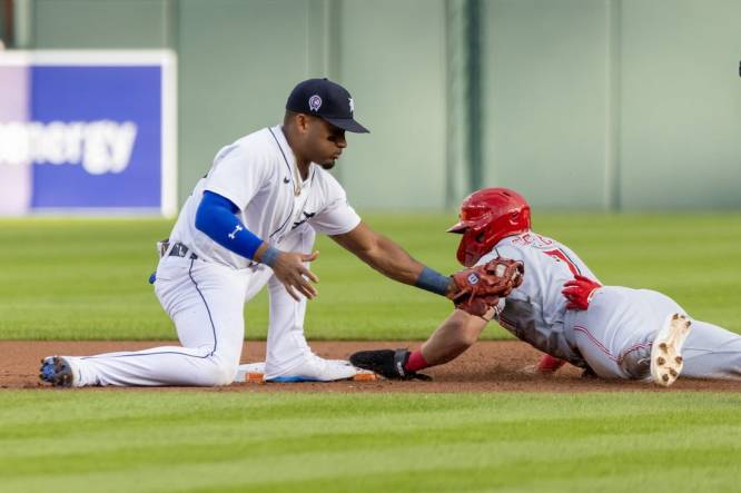 Sep 12, 2023; Detroit, Michigan, USA; Cincinnati Reds first baseman Spencer Steer (7) steals second base and beats the tag by Detroit Tigers shortstop Javier Baez (28) in the first inning at Comerica Park. Mandatory Credit: David Reginek-USA TODAY Sports