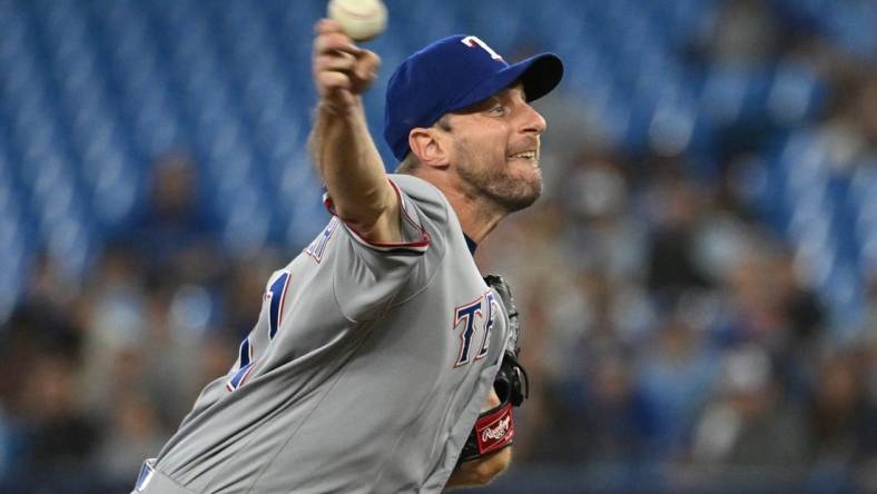 Sep 12, 2023; Toronto, Ontario, CAN;   Texas Rangers starting pitcher Max Scherzer (31) delivers a pitch against the Toronto Blue Jays in the first inning at Rogers Centre. Mandatory Credit: Dan Hamilton-USA TODAY Sports