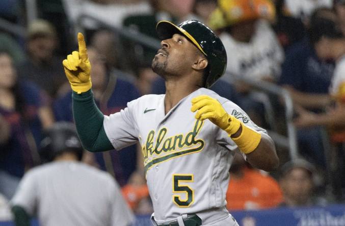 Sep 12, 2023; Houston, Texas, USA; Oakland Athletics left fielder Tony Kemp (5) reacts while rounding the bases after hitting a home run against the Houston Astros in the fifth inning at Minute Maid Park. Mandatory Credit: Thomas Shea-USA TODAY Sports