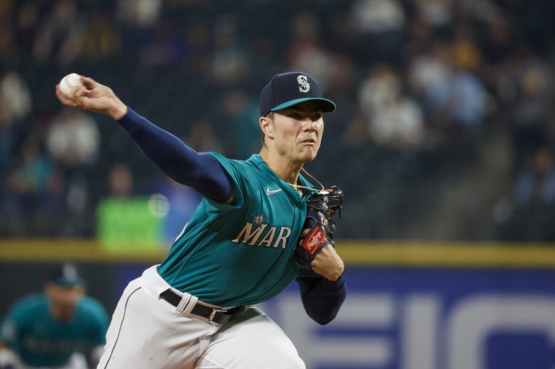 Sep 12, 2023; Seattle, Washington, USA; Seattle Mariners starting pitcher Bryan Woo (33) throws against the Los Angeles Angels during the first inning at T-Mobile Park. Mandatory Credit: Joe Nicholson-USA TODAY Sports