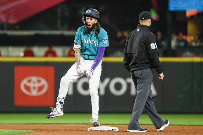 Sep 12, 2023; Seattle, Washington, USA; Seattle Mariners shortstop J.P. Crawford (3) celebrates after hitting a three-run double against the Los Angeles Angels during the fourth inning at T-Mobile Park. Mandatory Credit: Joe Nicholson-USA TODAY Sports