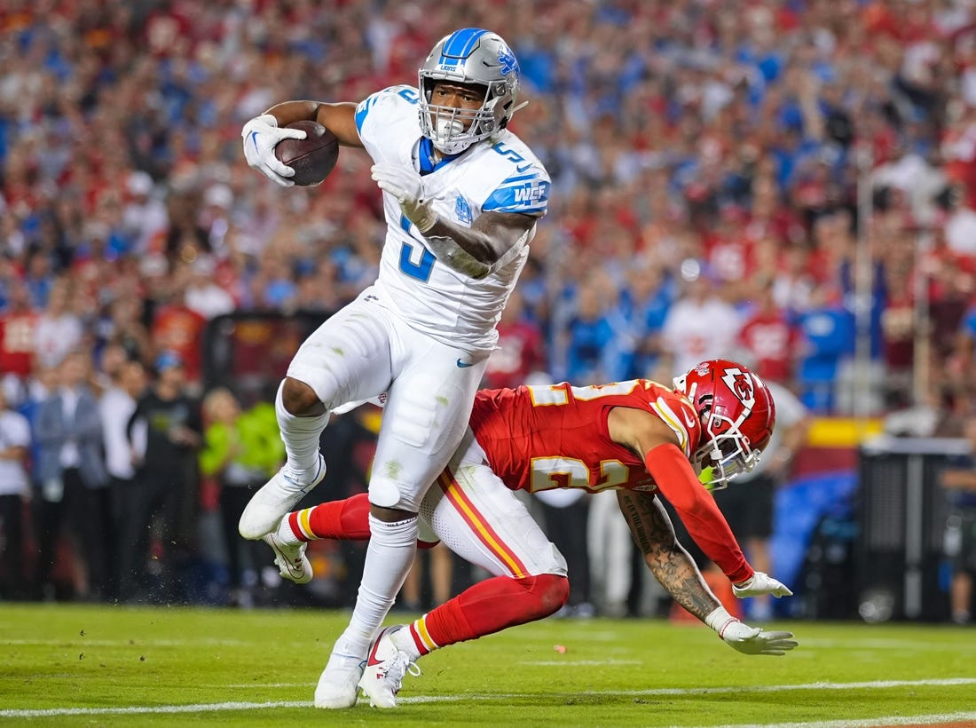 Sep 7, 2023; Kansas City, Missouri, USA; Detroit Lions running back David Montgomery (5) scores a touchdown against Kansas City Chiefs cornerback Trent McDuffie (22) during the second half at GEHA Field at Arrowhead Stadium. Mandatory Credit: Jay Biggerstaff-USA TODAY Sports