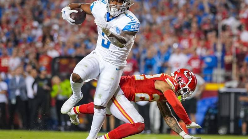 Sep 7, 2023; Kansas City, Missouri, USA; Detroit Lions running back David Montgomery (5) scores a touchdown against Kansas City Chiefs cornerback Trent McDuffie (22) during the second half at GEHA Field at Arrowhead Stadium. Mandatory Credit: Jay Biggerstaff-USA TODAY Sports