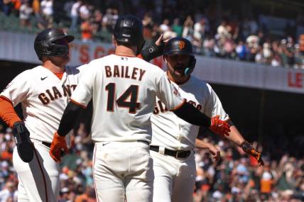Sep 13, 2023; San Francisco, California, USA; San Francisco Giants third baseman J.D. Davis (7) is congratulated after hitting a three run home run during the eighth inning against the Cleveland Guardians at Oracle Park. Mandatory Credit: Sergio Estrada-USA TODAY Sports
