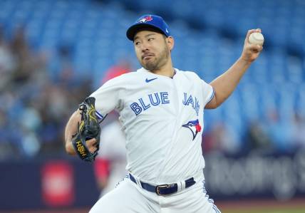Sep 13, 2023; Toronto, Ontario, CAN; Toronto Blue Jays starting pitcher Yusei Kikuchi (16) throws a pitch against the Texas Rangers during the first inning at Rogers Centre. Mandatory Credit: Nick Turchiaro-USA TODAY Sports