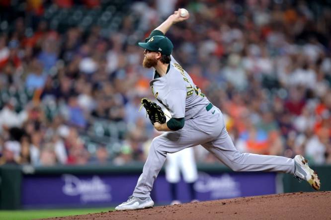Sep 13, 2023; Houston, Texas, USA; Oakland Athletics starting pitcher Paul Blackburn (58) delivers a pitch against the Houston Astros during the first inning at Minute Maid Park. Mandatory Credit: Erik Williams-USA TODAY Sports