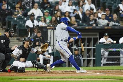 Sep 13, 2023; Chicago, Illinois, USA; Kansas City Royals second baseman Michael Massey (19) hits a two-run home run against the Chicago White Sox during the second inning at Guaranteed Rate Field. Mandatory Credit: Kamil Krzaczynski-USA TODAY Sports