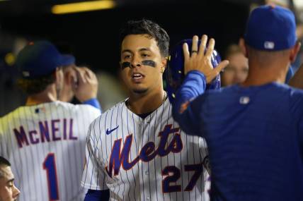 Sep 13, 2023; New York City, New York, USA; New York Mets designated hitter Mark Vientos (27) is congratulated by teammates for hitting a home run against the Arizona Diamondbacks during the sixth inning at Citi Field. Mandatory Credit: Gregory Fisher-USA TODAY Sports
