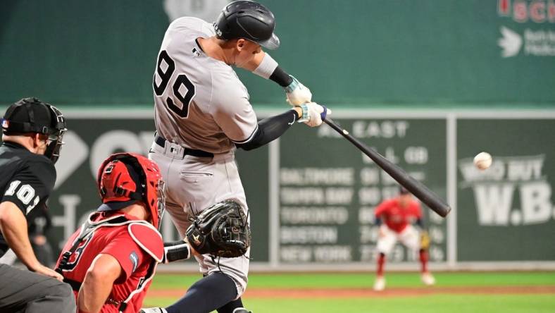 Sep 14, 2023; Boston, Massachusetts, USA; New York Yankees designated hitter Aaron Judge (99) hits a three run home run during the second inning against the Boston Red Sox at Fenway Park. Mandatory Credit: Eric Canha-USA TODAY Sports