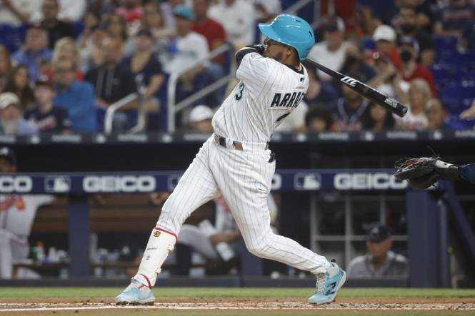 Sep 15, 2023; Miami, Florida, USA; Miami Marlins second baseman Luis Arraez (3) hits a home run against the Atlanta Braves during the first inning at loan Depot Park. Mandatory Credit: Rhona Wise-USA TODAY Sports