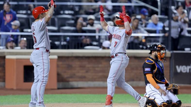Sep 15, 2023; New York City, New York, USA; Cincinnati Reds first baseman Spencer Steer (7) celebrates his two run home run against the New York Mets with third baseman Nick Senzel (15) during the sixth inning at Citi Field. Mandatory Credit: Brad Penner-USA TODAY Sports